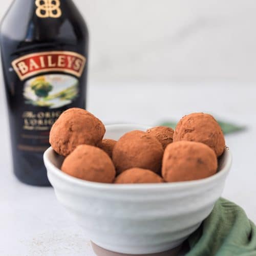 chocolate protein truffles with Baileys Irish cream in ceramic bowl