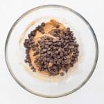 Chocolate chips folded into gluten free protein cookie dough