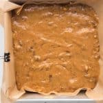 date cake batter poured into 8x8 pan