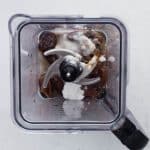 ingredients added to blender to make date caramel sauce for the date cake