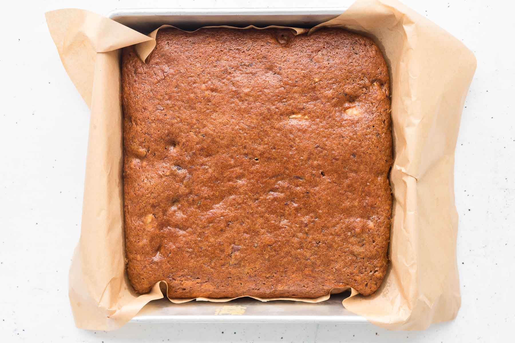 baked date cake in 8x8 pan