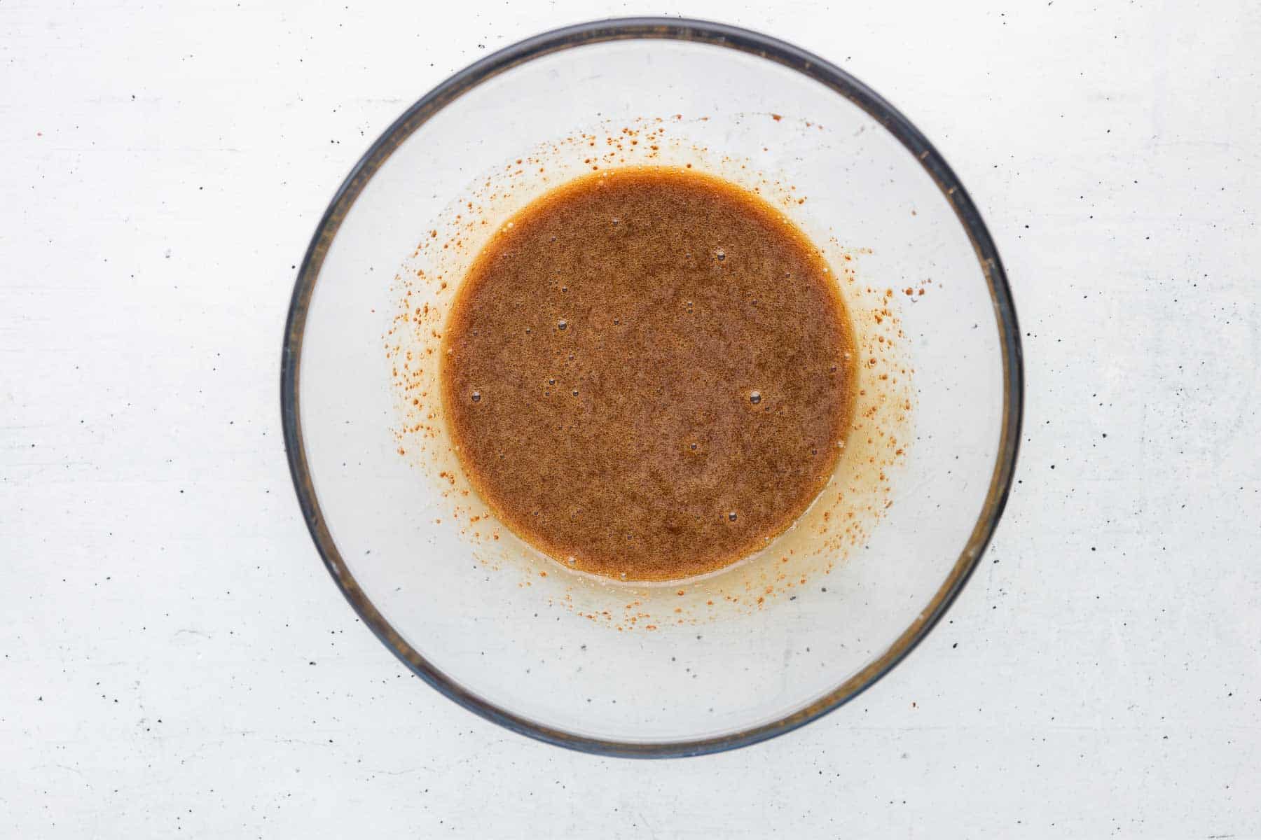 whisk together coconut sugar, maple syrup, olive oil, egg, and vanilla until smooth for the date cake