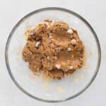 chopped mini eggs mixed into cookie dough protein mixture