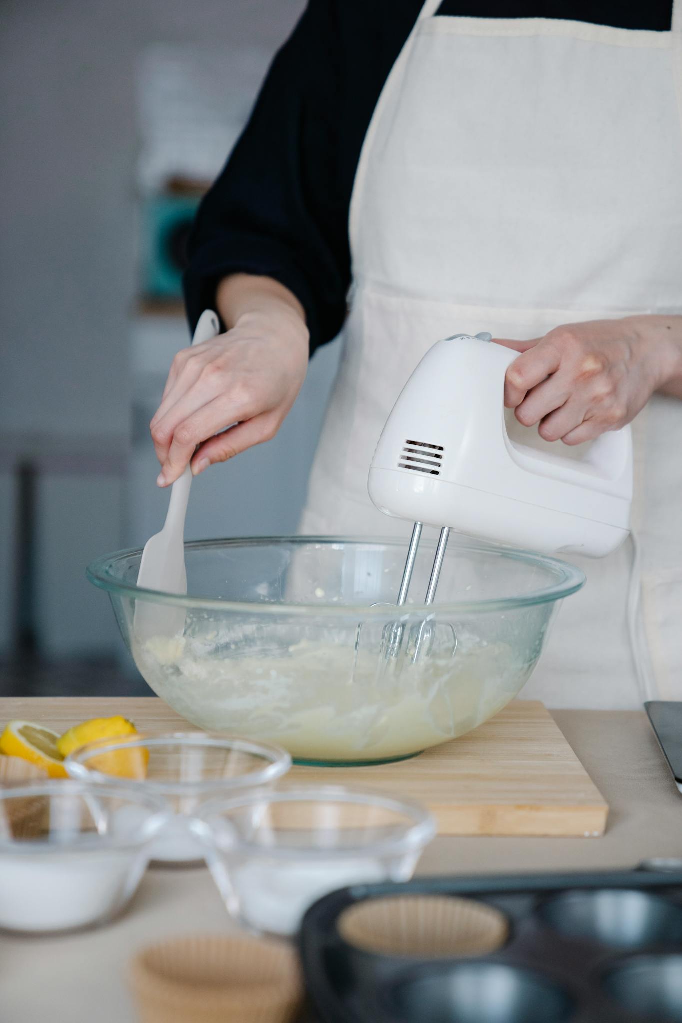 Photo by Felicity Tai creaming butter with a mixer in a kitchen setting.