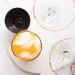 cocktail shaker filled with ice, uice from 1 lime (about 2 tbsp), and 1 cup mango passion fruit juice. If using non-alcoholic tequila, add it here as well, for Mango passionfruit mocktail