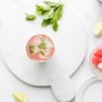 watermelon mint mojito topped with ice coconut water, apple cider vinegar, and sparkling water