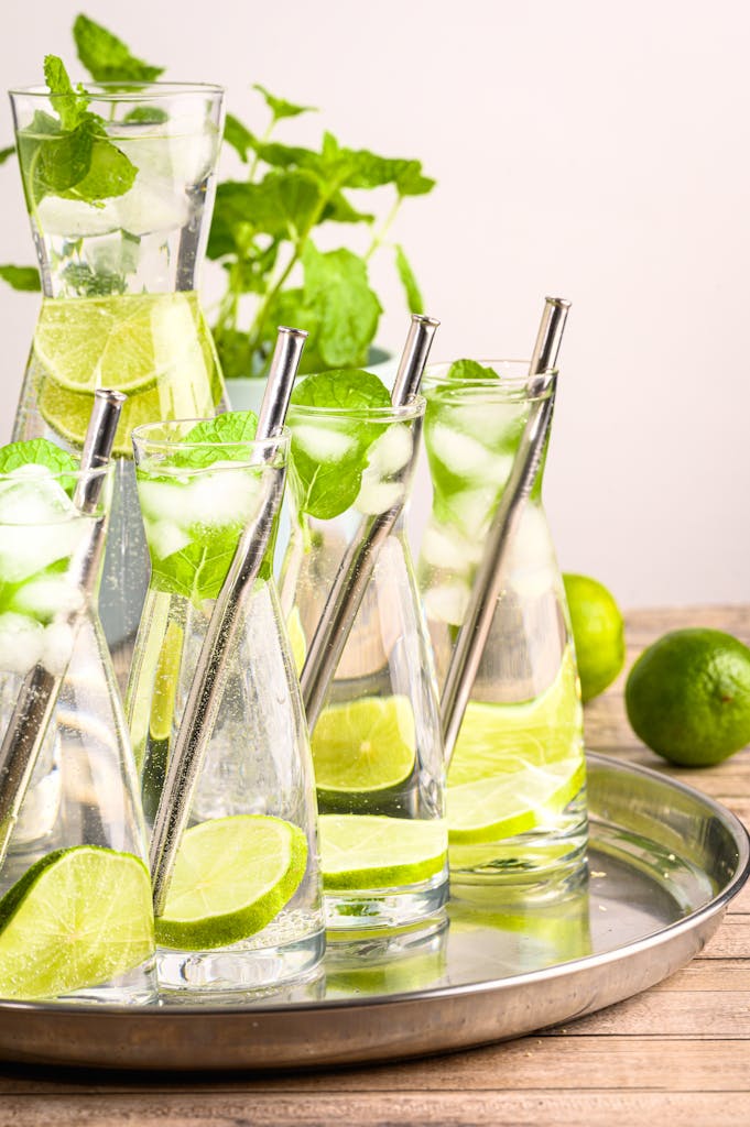 Close-up of mojito mocktail in glass carafes on a tray. Perfect for refreshment.