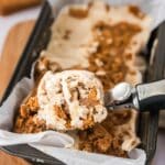 Close-up scoop of homemade Biscoff ice cream with cookie butter swirls and cookie pieces.