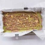 Layering chocolate cottage cheese ice cream with pistachio cream, melted chocolate, and toasted kataifi.