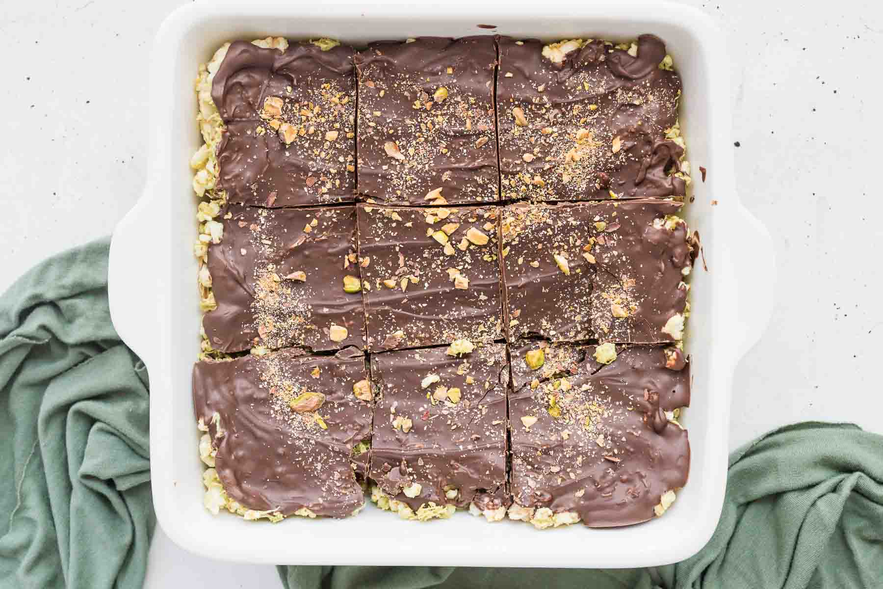 Close-up of sliced Dubai Chocolate Rice Cake Bars showing layers of rice cake, pistachio kataifi, and chocolate.