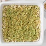 Spread the pistachio kataifi layer over the rice cake base.