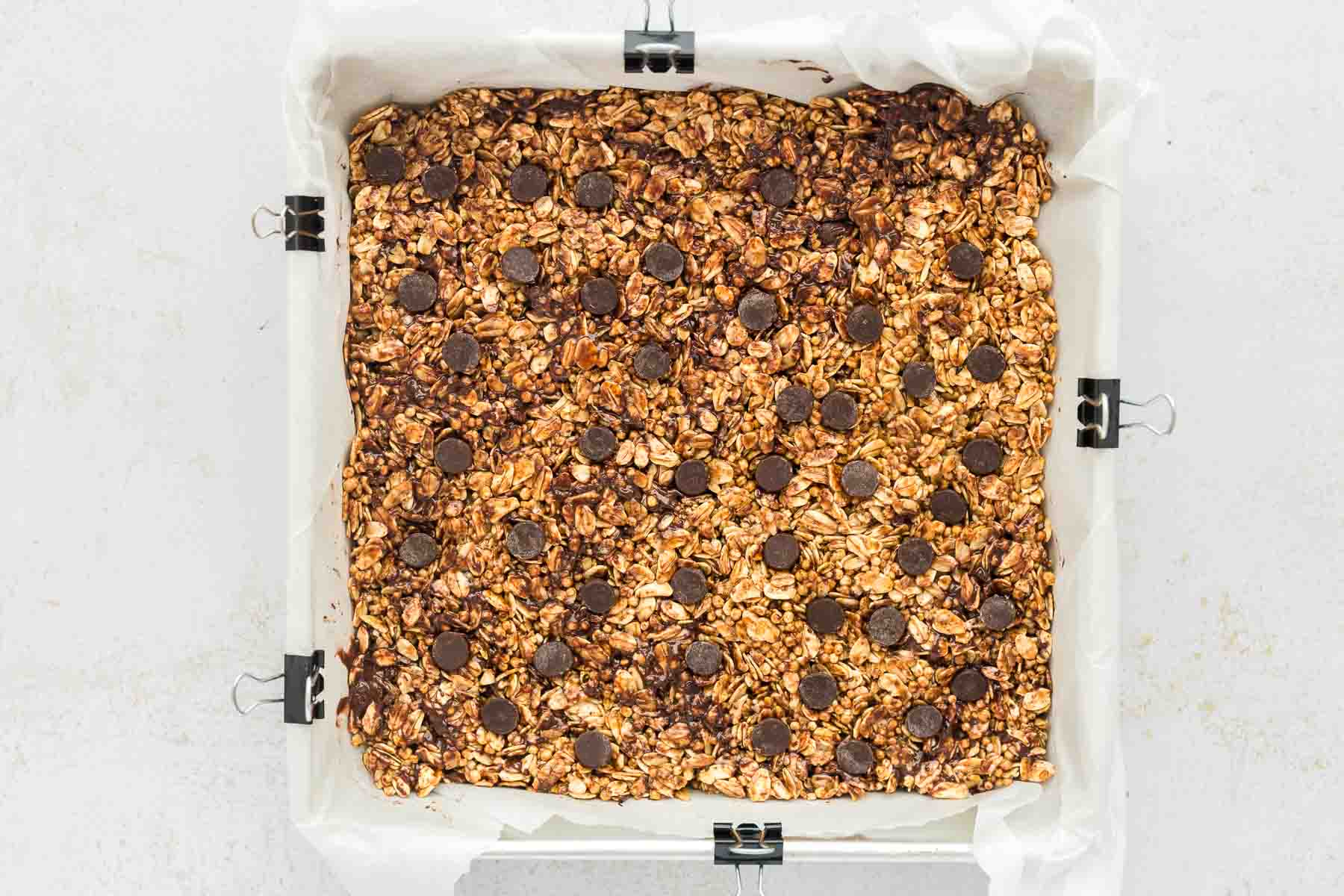 Homemade Chocolate Chip Granola Bars mixture pressed firmly into pan