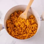 Fold in the remaining rice krispies cereal for the mini pumpkin pie rice krispie treats
