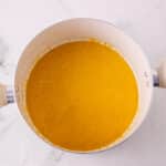 Marshmallows added to butter and pumpkin mix for rice krispie treats