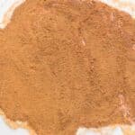 Cinnamon sugar and pumpkin spice filling sprinkled over buttered pumpkin dough